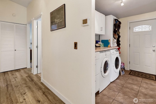 2610 E Section St Unit 25, Mount Vernon, WA 98274 - laundry area featuring cabinet space, washer and dryer, and light tile patterned floors