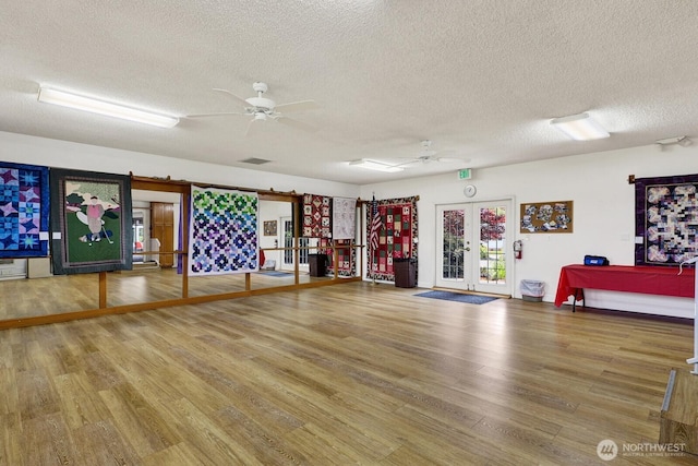 2610 E Section St Unit 25, Mount Vernon, WA 98274 - miscellaneous room with french doors, wood finished floors, a textured ceiling, and ceiling fan