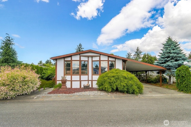 1427 100th St SW Unit 160, Everett, WA 98204 - tudor home with an attached carport and concrete driveway