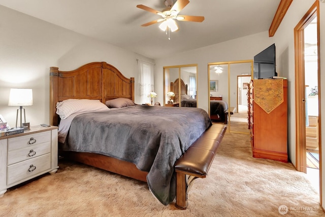 1427 100th St SW Unit 160, Everett, WA 98204 - bedroom with light colored carpet, two closets, and ceiling fan