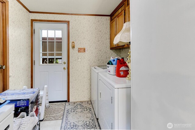 1427 100th St SW Unit 160, Everett, WA 98204 - laundry area featuring separate washer and dryer, ornamental molding, wallpapered walls, and cabinet space