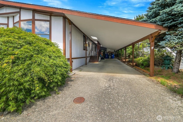 1427 100th St SW Unit 160, Everett, WA 98204 - view of parking / parking lot with an attached carport and concrete driveway