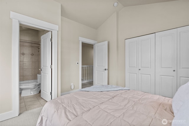 4252 Williams Ave W, Seattle, WA 98199 - carpeted bedroom with lofted ceiling, a closet, tile patterned floors, and ensuite bathroom