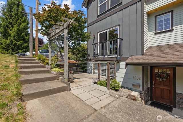 4252 Williams Ave W, Seattle, WA 98199 - view of property exterior featuring board and batten siding, a pergola, and roof with shingles