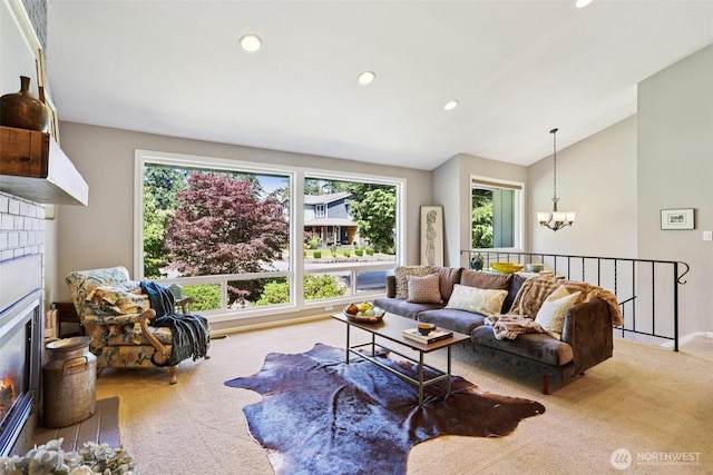 7622 130th Ave NE, Kirkland, WA 98033 - living area with carpet floors, a chandelier, recessed lighting, lofted ceiling, and a glass covered fireplace