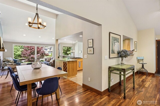 7622 130th Ave NE, Kirkland, WA 98033 - dining area with high vaulted ceiling, a chandelier, wood finished floors, and recessed lighting