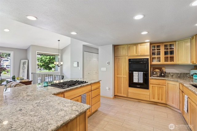 7622 130th Ave NE, Kirkland, WA 98033 - kitchen featuring black appliances, recessed lighting, light stone counters, glass insert cabinets, and a textured ceiling