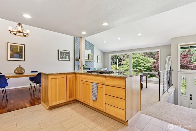 7622 130th Ave NE, Kirkland, WA 98033 - kitchen with stainless steel gas stovetop, light wood-style floors, a chandelier, vaulted ceiling, and light brown cabinetry