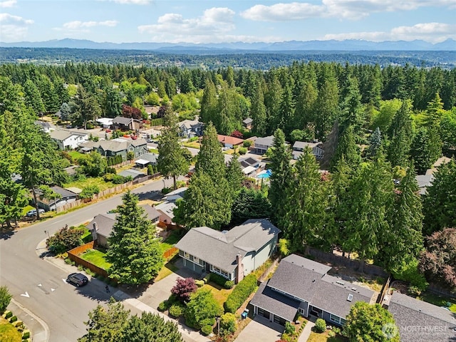 7622 130th Ave NE, Kirkland, WA 98033 - aerial perspective of suburban area with a forest and a mountainous background