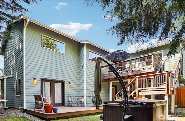 7622 130th Ave NE, Kirkland, WA 98033 - rear view of property featuring a hot tub, a wooden deck, and french doors