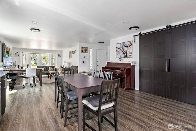538 NW Ensign Dr, Oak Harbor, WA 98277 - dining area with dark wood-style floors, a barn door, and a desk