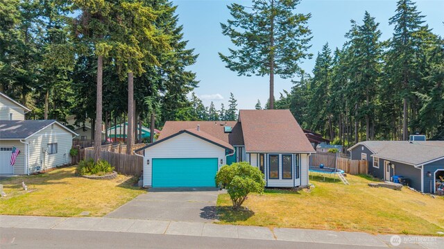 538 NW Ensign Dr, Oak Harbor, WA 98277 - view of front facade with a trampoline and asphalt driveway
