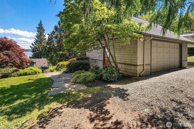 14830 Glen Acres Rd SW, Vashon, WA 98070 - view of property exterior with a lawn and driveway