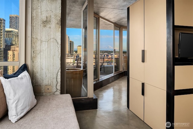 2125 1st Ave Unit 3003, Seattle, WA 98121 - bedroom featuring finished concrete flooring and a wall of windows