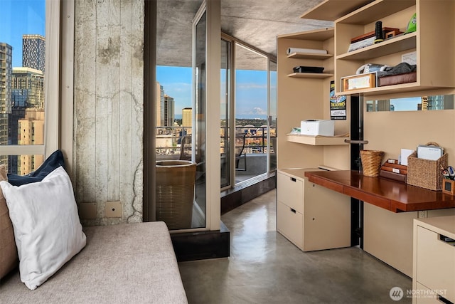 2125 1st Ave Unit 3003, Seattle, WA 98121 - bedroom featuring a skyline view and finished concrete flooring