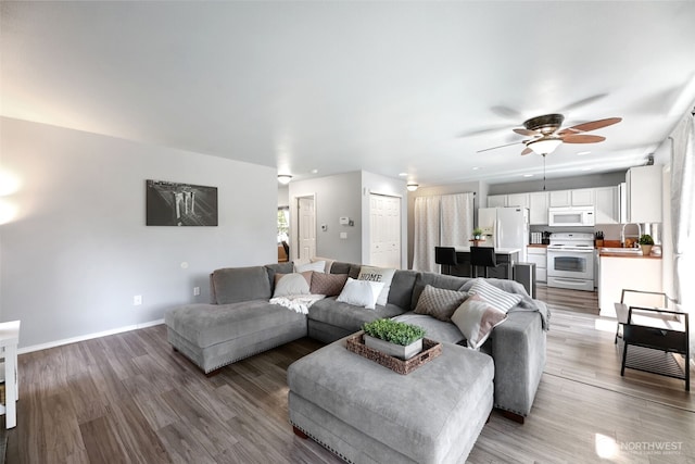 13421 Elk Ridge Rd SE, Monroe, WA 98272 - living area featuring a ceiling fan and light wood-style flooring