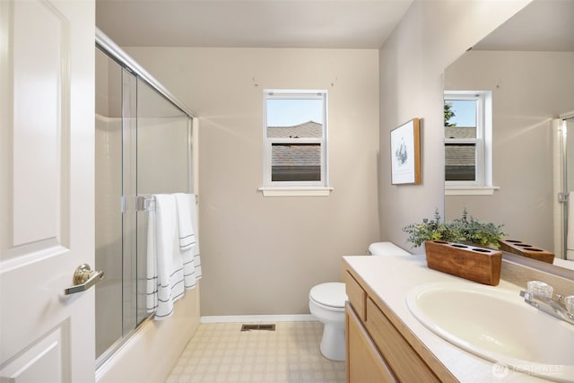 13421 Elk Ridge Rd SE, Monroe, WA 98272 - bathroom with tile patterned floors, vanity, healthy amount of natural light, and combined bath / shower with glass door