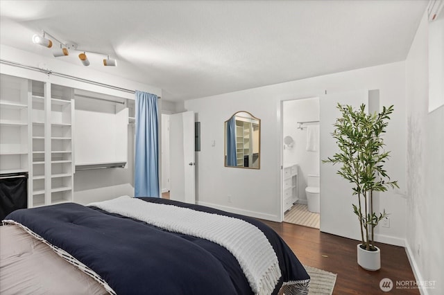 2636 22nd Ave W Unit 101, Seattle, WA 98199 - bedroom featuring wood finished floors and connected bathroom