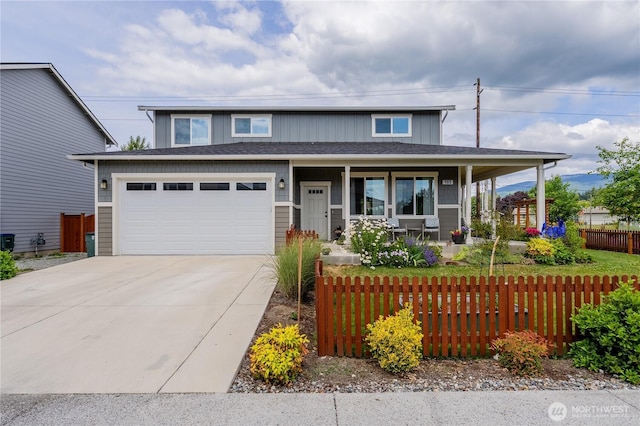 103N Trail Rd, Sedro Woolley, WA 98284 - view of front of home featuring covered porch, concrete driveway, and an attached garage