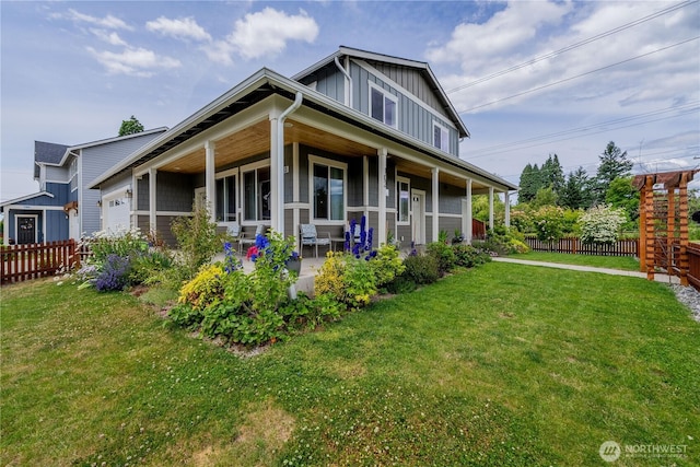 103N Trail Rd, Sedro Woolley, WA 98284 - view of front of home with board and batten siding, covered porch, and a garage