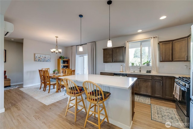 103N Trail Rd, Sedro Woolley, WA 98284 - kitchen featuring stainless steel appliances, light wood-style floors, decorative backsplash, a chandelier, and recessed lighting