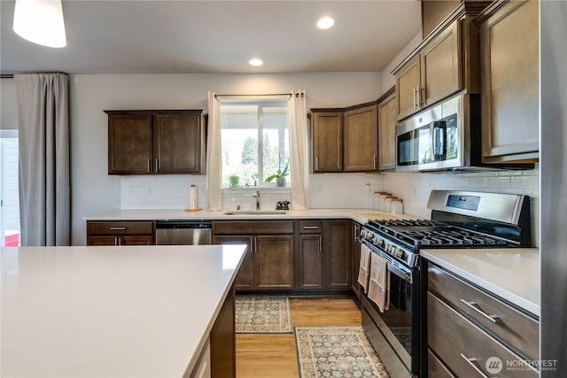 103N Trail Rd, Sedro Woolley, WA 98284 - kitchen featuring stainless steel appliances, recessed lighting, light wood-style flooring, light countertops, and tasteful backsplash