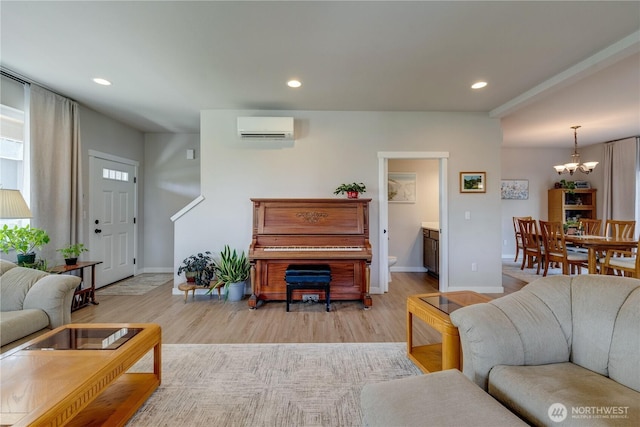 103N Trail Rd, Sedro Woolley, WA 98284 - living area featuring an AC wall unit, a chandelier, recessed lighting, and light wood-style floors