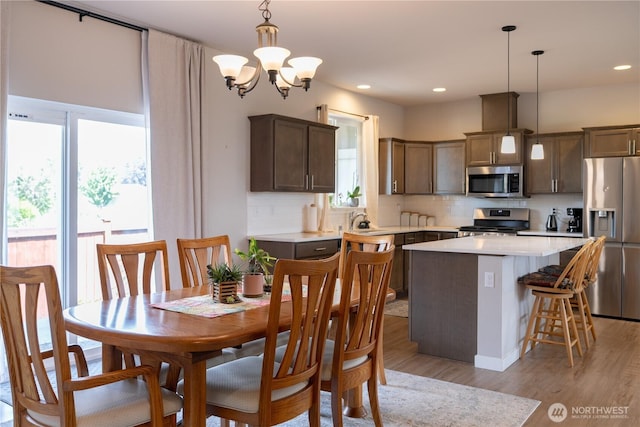 103N Trail Rd, Sedro Woolley, WA 98284 - dining space featuring plenty of natural light, a chandelier, light wood-style floors, and recessed lighting