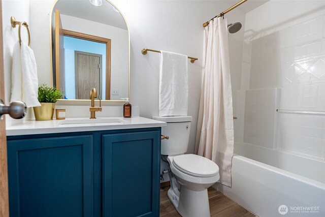 7801 144th Street Ct E, Puyallup, WA 98375 - full bathroom featuring vanity, shower / bath combo with shower curtain, and wood finished floors
