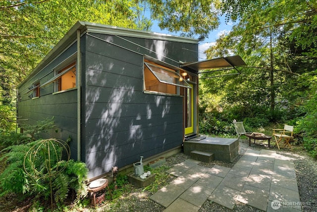 11230 Asta Ln SW, Vashon, WA 98070 - view of outbuilding with an outdoor fire pit