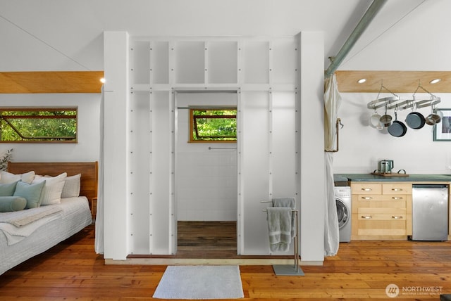 11230 Asta Ln SW, Vashon, WA 98070 - interior space featuring light wood-style floors, washer / clothes dryer, and open floor plan