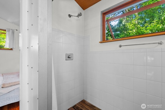 11230 Asta Ln SW, Vashon, WA 98070 - ensuite bathroom with a tile shower, lofted ceiling, and wood finished floors