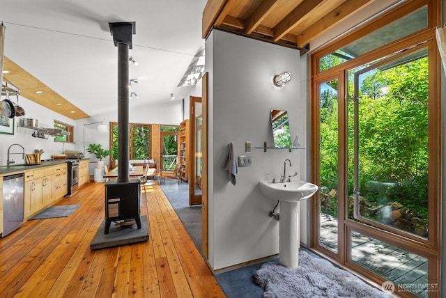 11230 Asta Ln SW, Vashon, WA 98070 - bathroom featuring a wood stove and wood-type flooring