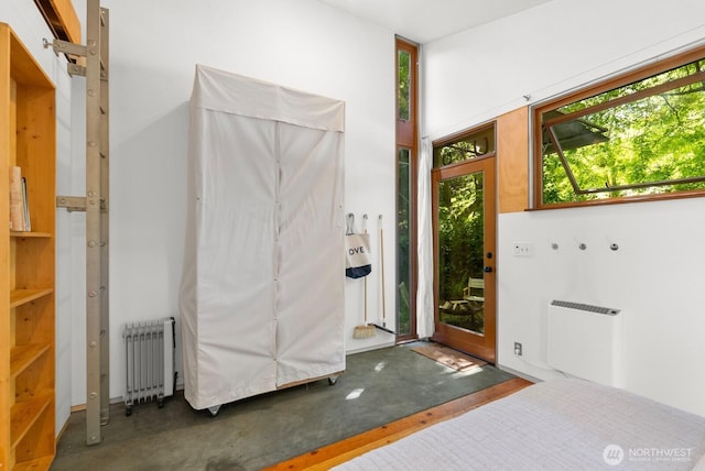 11230 Asta Ln SW, Vashon, WA 98070 - entrance foyer featuring radiator and concrete flooring