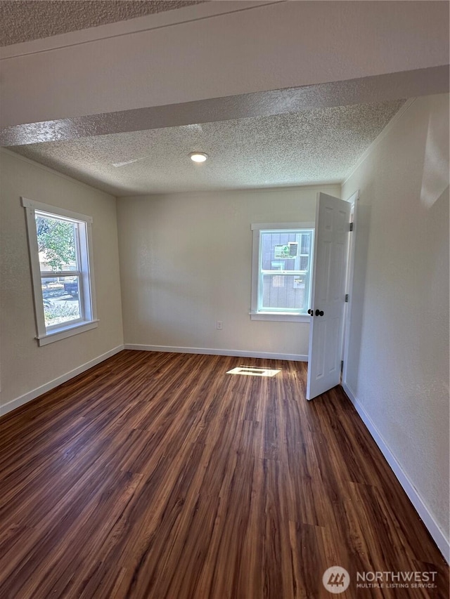 836 S Cashmere St, Wenatchee, WA 98801 - spare room featuring dark wood-style floors and a textured ceiling