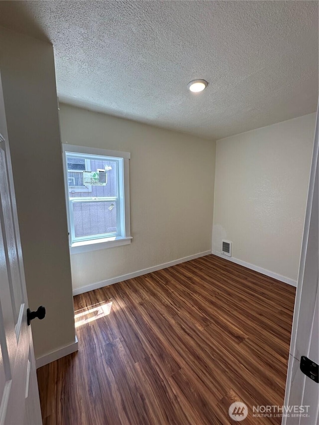 836 S Cashmere St, Wenatchee, WA 98801 - spare room featuring wood finished floors and a textured ceiling
