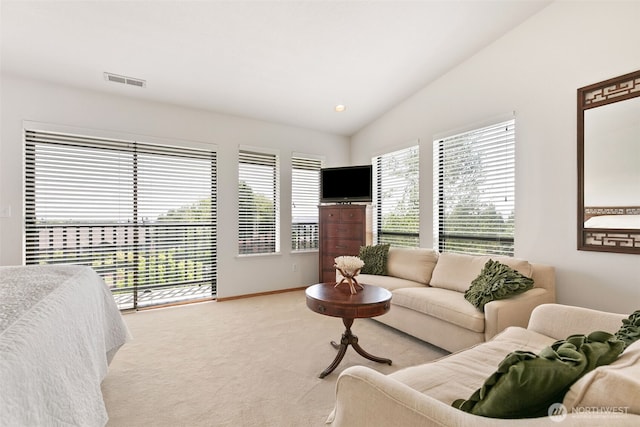 7610 Scenic Dr, Yakima, WA 98908 - carpeted living area featuring vaulted ceiling and baseboards