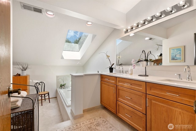 7610 Scenic Dr, Yakima, WA 98908 - full bath featuring a skylight, vaulted ceiling, double vanity, a garden tub, and tile patterned floors