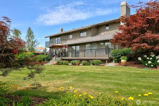 7610 Scenic Dr, Yakima, WA 98908 - rear view of house with a chimney, a lawn, and a balcony