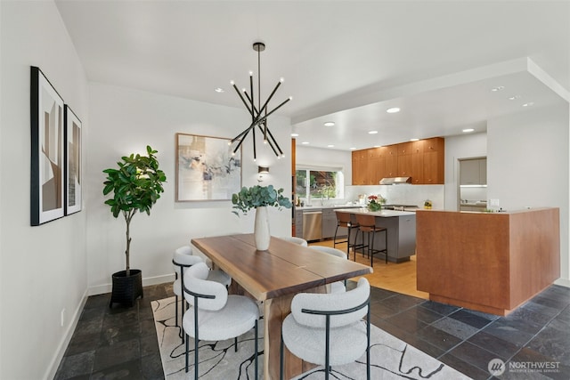 8812 NE 117th Pl, Kirkland, WA 98034 - dining area featuring a chandelier, dark stone finish flooring, and recessed lighting