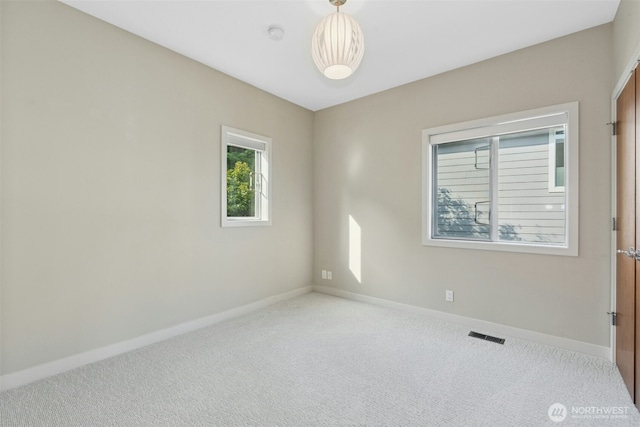 8812 NE 117th Pl, Kirkland, WA 98034 - carpeted spare room with baseboards and a smoke detector