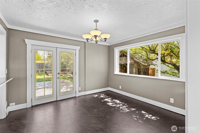 2812 Nome St, Bellingham, WA 98225 - spare room with a chandelier, french doors, plenty of natural light, crown molding, and a textured ceiling