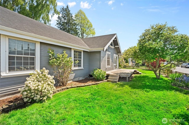 2812 Nome St, Bellingham, WA 98225 - view of side of home featuring a deck, a lawn, and a shingled roof