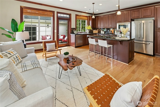 2621 NE Park Dr, Issaquah, WA 98029 - living area with light wood-type flooring, crown molding, and recessed lighting