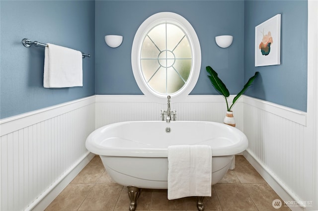 2621 NE Park Dr, Issaquah, WA 98029 - bathroom featuring a wainscoted wall, a soaking tub, and tile patterned floors