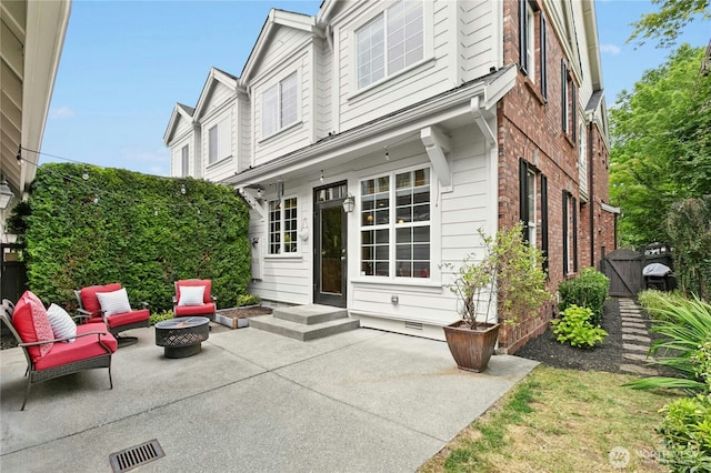 2621 NE Park Dr, Issaquah, WA 98029 - exterior space with a patio area, a fire pit, crawl space, and brick siding