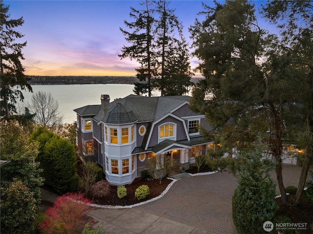 8071 W Mercer Way, Mercer Island, WA 98040 - shingle-style home featuring a water view, a chimney, and decorative driveway