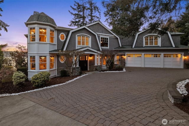 8071 W Mercer Way, Mercer Island, WA 98040 - shingle-style home featuring decorative driveway, a gambrel roof, and stone siding