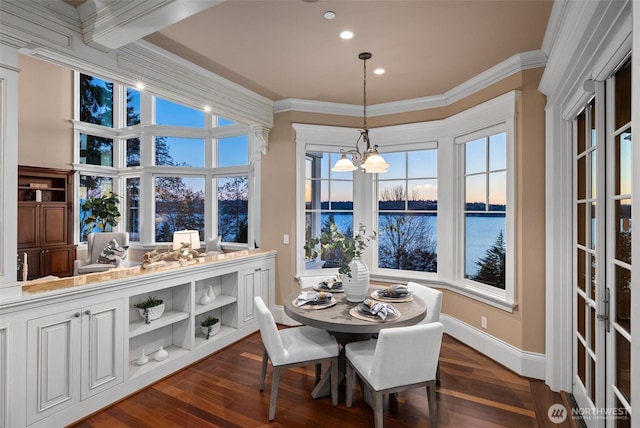 8071 W Mercer Way, Mercer Island, WA 98040 - dining space featuring a water view, crown molding, recessed lighting, and dark wood-style flooring
