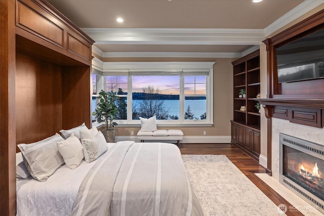8071 W Mercer Way, Mercer Island, WA 98040 - bedroom with crown molding, a fireplace with flush hearth, dark wood-type flooring, and recessed lighting